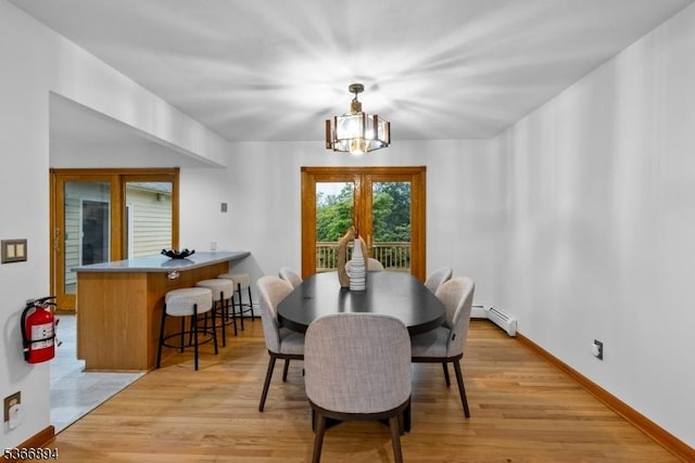 11 Hillcrest Blvd, Warren Twp, NJ 07059 - dining area with a chandelier, light wood-style flooring, and baseboard heating