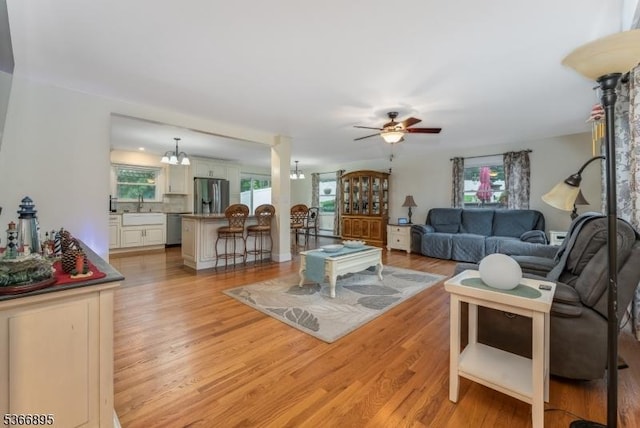 417 Mountain Rd, Readington Twp, NJ 08833 - living area featuring ceiling fan, light wood finished floors, and a chandelier