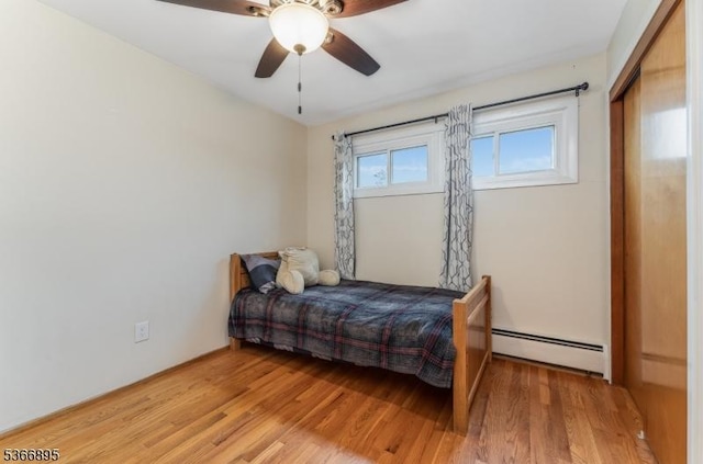 417 Mountain Rd, Readington Twp, NJ 08833 - bedroom with baseboard heating, light wood finished floors, and a ceiling fan