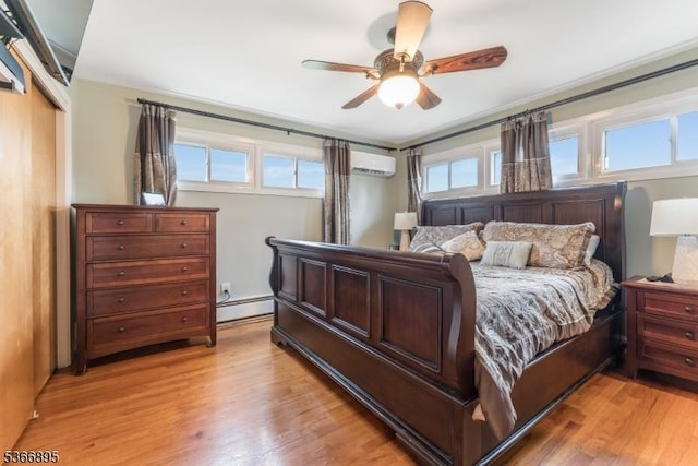 417 Mountain Rd, Readington Twp, NJ 08833 - bedroom featuring light wood-style floors, a wall mounted AC, a baseboard heating unit, a ceiling fan, and a closet