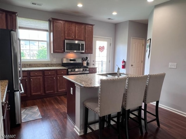 108 Creekside Way, Burlington Twp, NJ 08016 - kitchen with stainless steel appliances, dark wood-type flooring, a kitchen bar, light stone counters, and recessed lighting