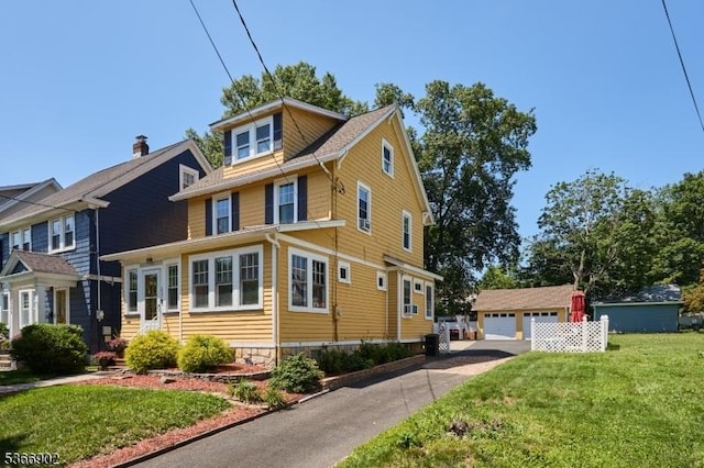 227 Parker Ave, Maplewood Twp, NJ 07040 - view of front of house with a detached garage, an outdoor structure, a front yard, and entry steps