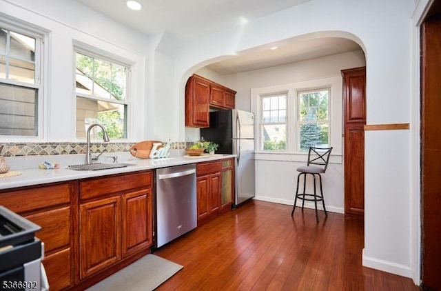 227 Parker Ave, Maplewood Twp, NJ 07040 - kitchen featuring appliances with stainless steel finishes, arched walkways, plenty of natural light, tasteful backsplash, and recessed lighting