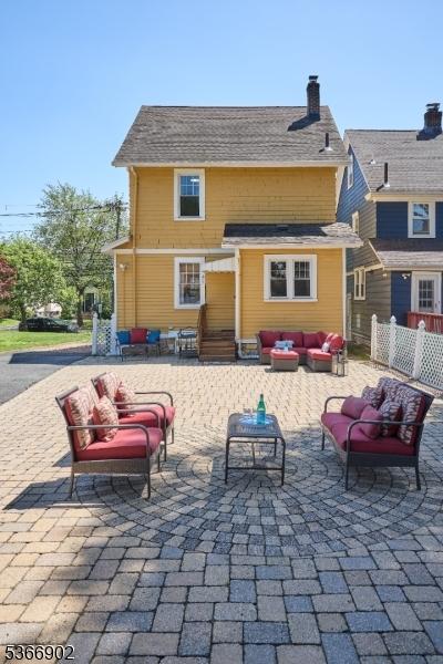 227 Parker Ave, Maplewood Twp, NJ 07040 - rear view of house with an outdoor hangout area, a patio area, and a chimney