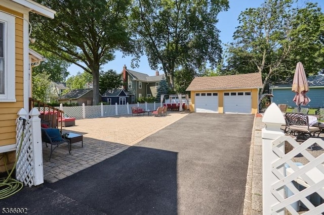 227 Parker Ave, Maplewood Twp, NJ 07040 - view of yard featuring a garage, an outdoor structure, and a residential view