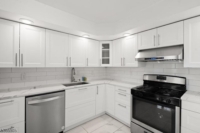 4106 Dilts Ln, Bridgewater Twp, NJ 08807 - kitchen with appliances with stainless steel finishes, under cabinet range hood, white cabinets, backsplash, and light stone countertops