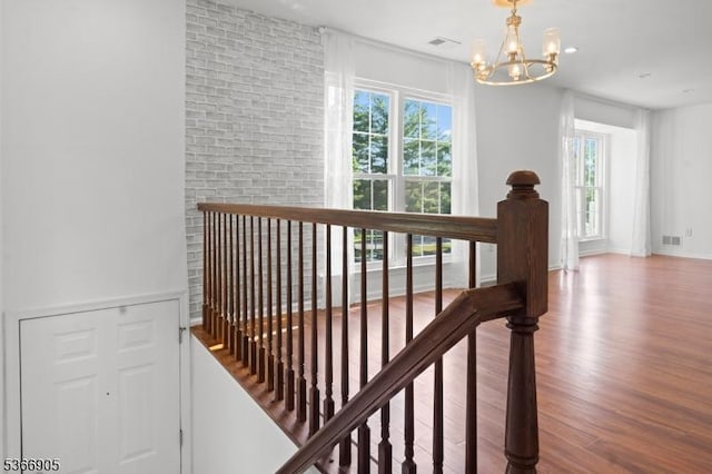 4106 Dilts Ln, Bridgewater Twp, NJ 08807 - hallway with a chandelier, an upstairs landing, and wood finished floors