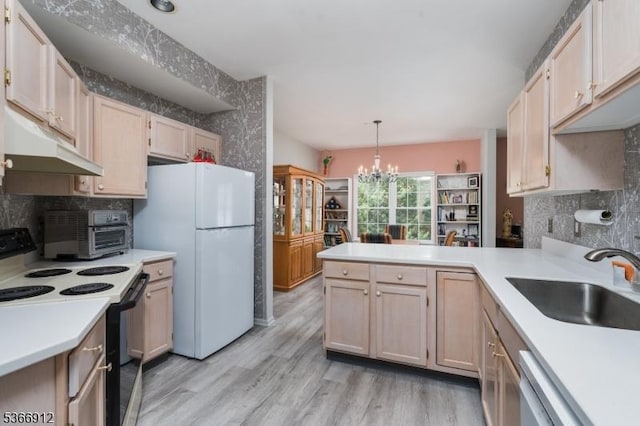 2 Richmond Rd Unit 214, West Milford Twp, NJ 07480 - kitchen featuring black range with electric stovetop, under cabinet range hood, freestanding refrigerator, light countertops, and light wood-style flooring
