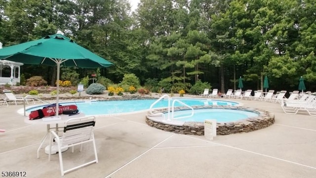2 Richmond Rd Unit 214, West Milford Twp, NJ 07480 - community pool featuring a patio area and view of wooded area