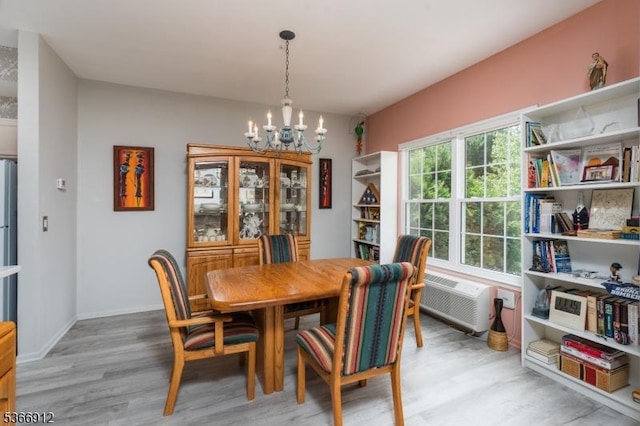 2 Richmond Rd Unit 214, West Milford Twp, NJ 07480 - dining room with a chandelier, light wood-style flooring, and a wall mounted AC