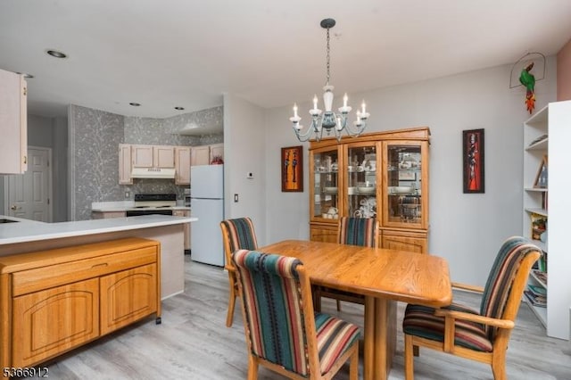 2 Richmond Rd Unit 214, West Milford Twp, NJ 07480 - dining area featuring a chandelier and light wood-style flooring