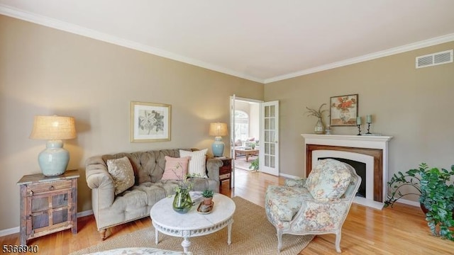 24 Montfort Dr, Montgomery Twp, NJ 08502 - living room with wood finished floors, a fireplace with flush hearth, and ornamental molding