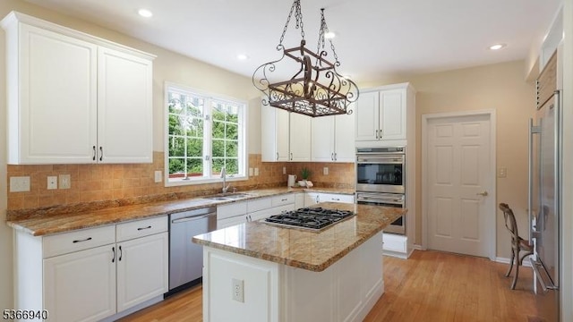 24 Montfort Dr, Montgomery Twp, NJ 08502 - kitchen featuring stainless steel appliances, white cabinetry, a chandelier, light wood-style flooring, and recessed lighting