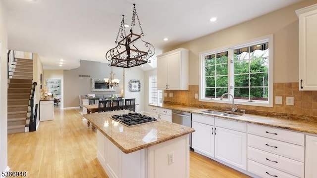 24 Montfort Dr, Montgomery Twp, NJ 08502 - kitchen featuring appliances with stainless steel finishes, a center island, white cabinetry, plenty of natural light, and recessed lighting