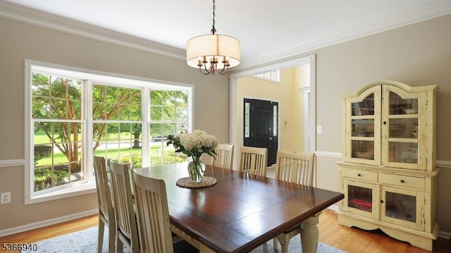 24 Montfort Dr, Montgomery Twp, NJ 08502 - dining room with a chandelier, ornamental molding, and light wood-type flooring