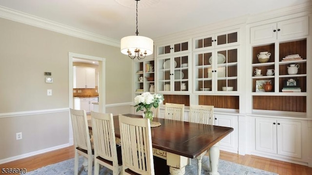 24 Montfort Dr, Montgomery Twp, NJ 08502 - dining room with a chandelier, light wood-style floors, and crown molding