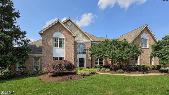 24 Montfort Dr, Montgomery Twp, NJ 08502 - view of front of home featuring a front lawn and brick siding