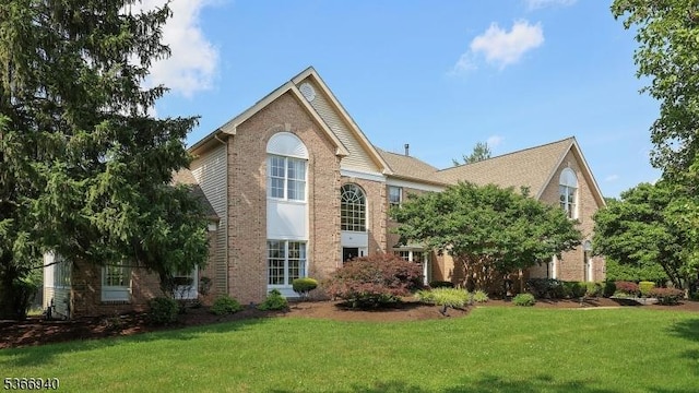 24 Montfort Dr, Montgomery Twp, NJ 08502 - view of front of property featuring a front yard and brick siding
