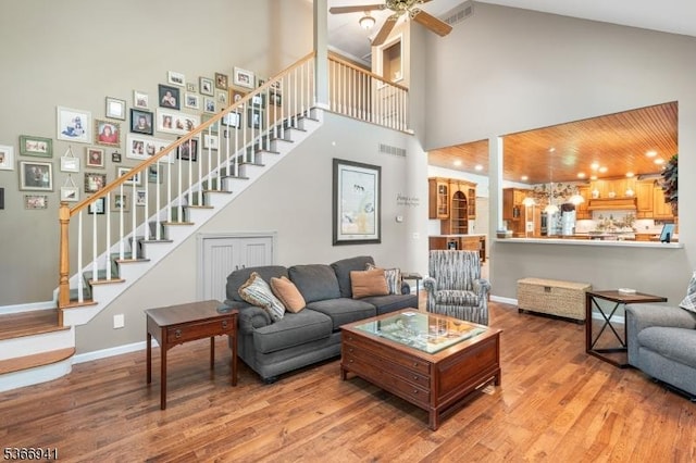 21 Partridge Rd, Readington Twp, NJ 08822 - living room with stairway, a towering ceiling, wood finished floors, and a ceiling fan