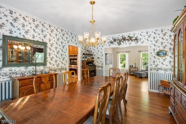 21 Partridge Rd, Readington Twp, NJ 08822 - dining space featuring wallpapered walls, a chandelier, dark wood-style flooring, and crown molding