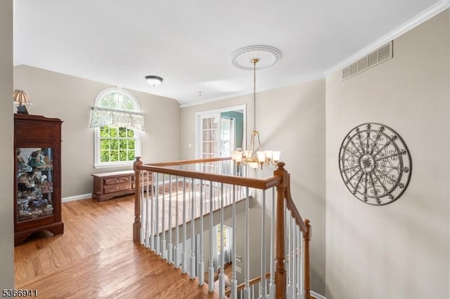 21 Partridge Rd, Readington Twp, NJ 08822 - hallway featuring an upstairs landing, a chandelier, wood finished floors, and crown molding