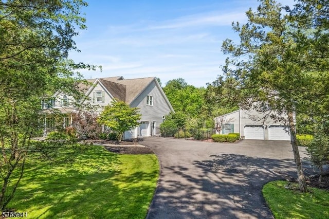 21 Partridge Rd, Readington Twp, NJ 08822 - view of front of home featuring asphalt driveway, a garage, and a front lawn