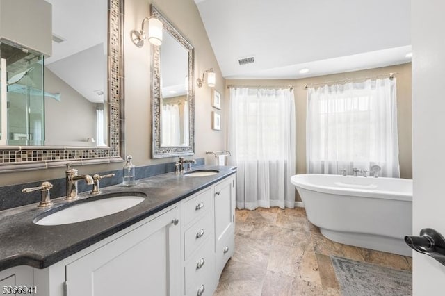 21 Partridge Rd, Readington Twp, NJ 08822 - full bath with double vanity, a soaking tub, vaulted ceiling, and stone finish flooring