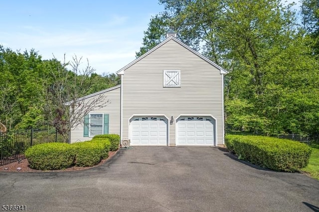 21 Partridge Rd, Readington Twp, NJ 08822 - view of side of home featuring driveway and an attached garage