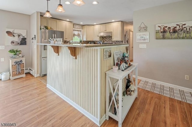 28 Old Beaver Run Rd, Lafayette Twp, NJ 07848 - kitchen featuring under cabinet range hood, stainless steel fridge, a kitchen breakfast bar, baseboard heating, and light wood finished floors