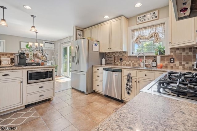 28 Old Beaver Run Rd, Lafayette Twp, NJ 07848 - kitchen featuring appliances with stainless steel finishes, cream cabinets, light countertops, backsplash, and pendant lighting