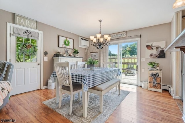 28 Old Beaver Run Rd, Lafayette Twp, NJ 07848 - dining space with a chandelier, a baseboard heating unit, light wood finished floors, and an AC wall unit
