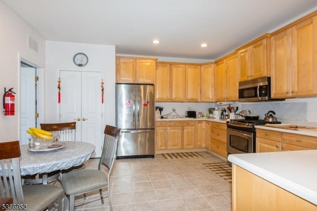 8202 Westover Way Unit 8202, Franklin Twp, NJ 08873 - kitchen with stainless steel appliances, light countertops, recessed lighting, light brown cabinets, and backsplash