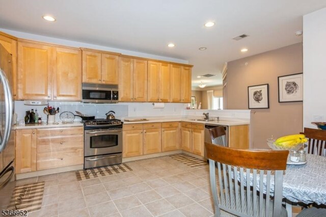 8202 Westover Way Unit 8202, Franklin Twp, NJ 08873 - kitchen featuring stainless steel appliances, light countertops, recessed lighting, light brown cabinetry, and light tile patterned flooring