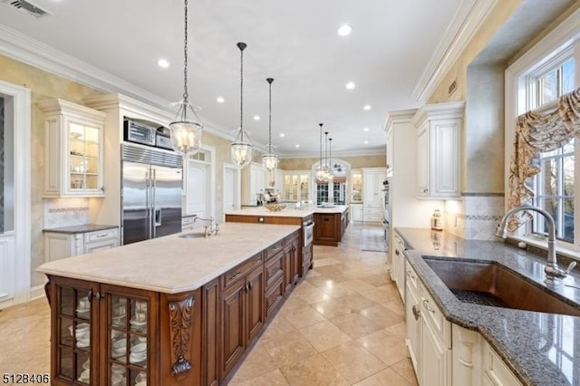 141 Mountaintop Rd, Bernardsville Boro, NJ 07924 - kitchen featuring stainless steel built in refrigerator, a large island with sink, glass insert cabinets, backsplash, and recessed lighting
