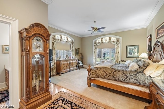141 Mountaintop Rd, Bernardsville Boro, NJ 07924 - bedroom with ornamental molding, a ceiling fan, wood finished floors, and arched walkways