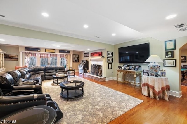 141 Mountaintop Rd, Bernardsville Boro, NJ 07924 - living area featuring crown molding, wood finished floors, recessed lighting, and a fireplace with raised hearth