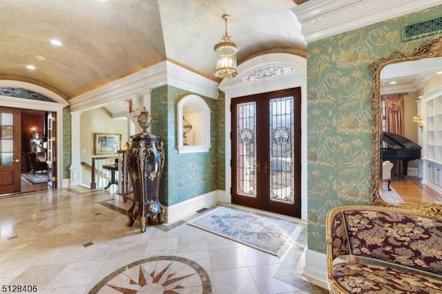 141 Mountaintop Rd, Bernardsville Boro, NJ 07924 - foyer featuring french doors, lofted ceiling, wallpapered walls, plenty of natural light, and ornamental molding
