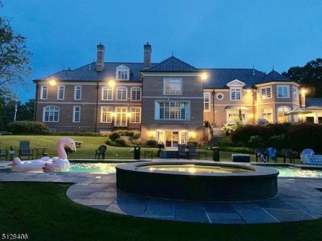 141 Mountaintop Rd, Bernardsville Boro, NJ 07924 - rear view of house with a yard, a chimney, and a pool with connected hot tub