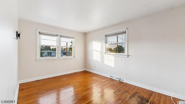 32 Washington Ave, Edgewater Park Twp, NJ 08010 - spare room with wood finished floors and healthy amount of natural light
