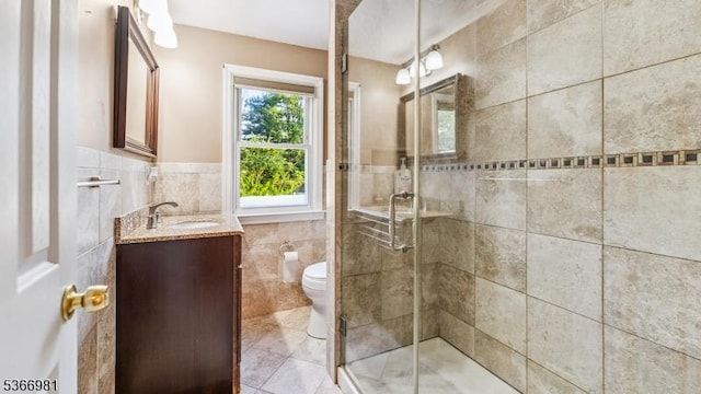 32 Washington Ave, Edgewater Park Twp, NJ 08010 - full bathroom with tile walls, vanity, a shower stall, a wainscoted wall, and tile patterned floors