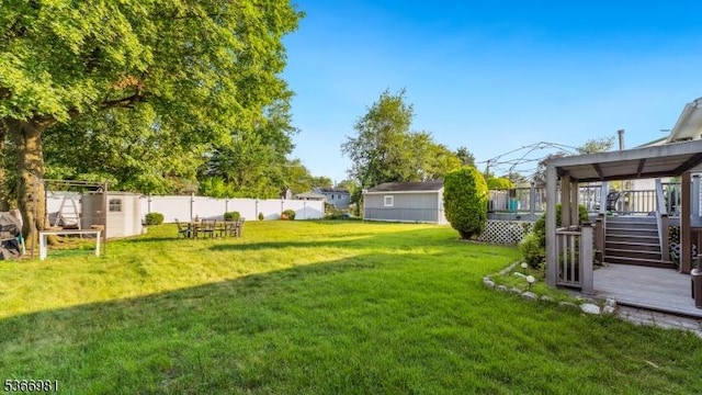 32 Washington Ave, Edgewater Park Twp, NJ 08010 - view of yard with a deck, a storage shed, and stairs