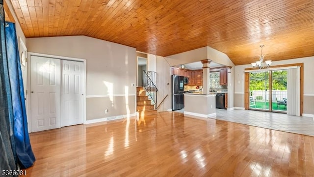 32 Washington Ave, Edgewater Park Twp, NJ 08010 - unfurnished living room featuring vaulted ceiling, a chandelier, wood ceiling, light wood finished floors, and stairway