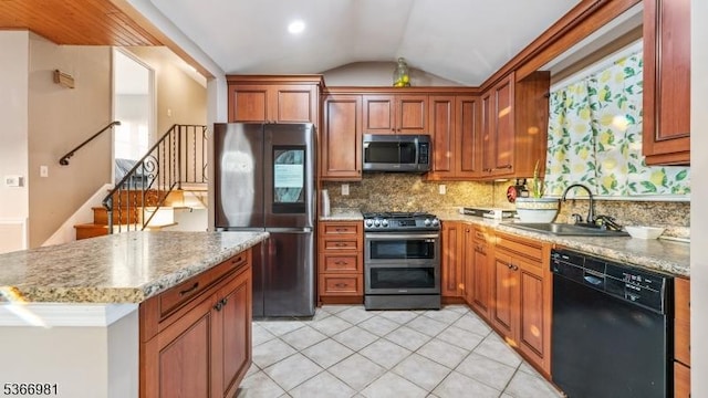 32 Washington Ave, Edgewater Park Twp, NJ 08010 - kitchen with appliances with stainless steel finishes, vaulted ceiling, backsplash, light tile patterned flooring, and a kitchen island