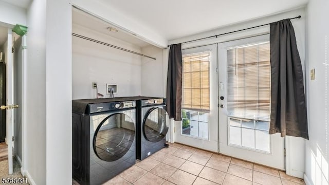 32 Washington Ave, Edgewater Park Twp, NJ 08010 - laundry area with french doors, independent washer and dryer, and light tile patterned floors