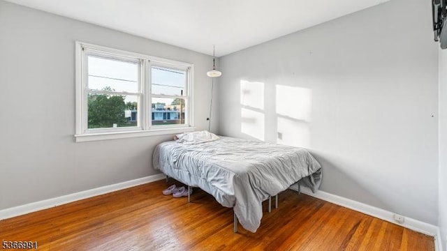 32 Washington Ave, Edgewater Park Twp, NJ 08010 - bedroom with baseboards and wood finished floors