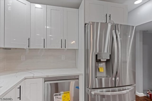 204 Christopher St, Hackettstown Town, NJ 07840 - kitchen with stainless steel refrigerator with ice dispenser, white cabinetry, and light stone countertops