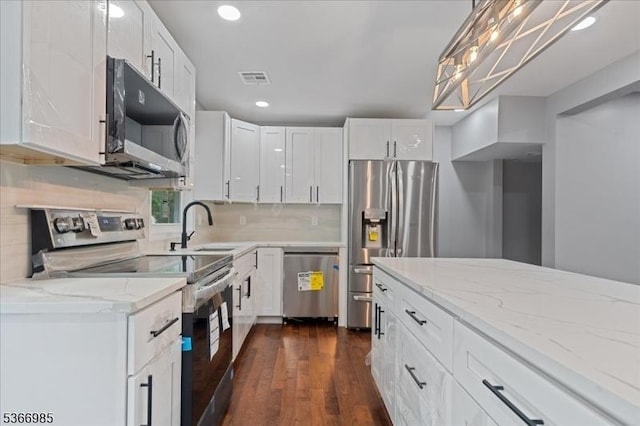 204 Christopher St, Hackettstown Town, NJ 07840 - kitchen with appliances with stainless steel finishes, white cabinetry, light stone countertops, dark wood finished floors, and recessed lighting