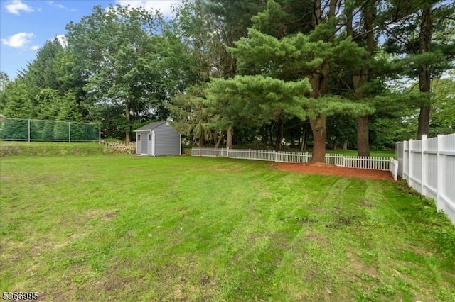 204 Christopher St, Hackettstown Town, NJ 07840 - fenced backyard featuring a storage shed and view of wooded area