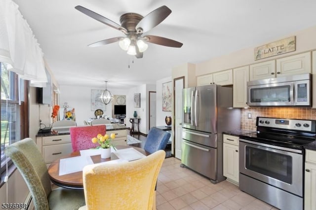 11 Washington St, Mount Olive Twp, NJ 07828 - kitchen featuring stainless steel appliances, dark countertops, backsplash, and a ceiling fan