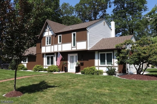 11 Washington St, Mount Olive Twp, NJ 07828 - tudor house with a shingled roof, a front lawn, and a chimney